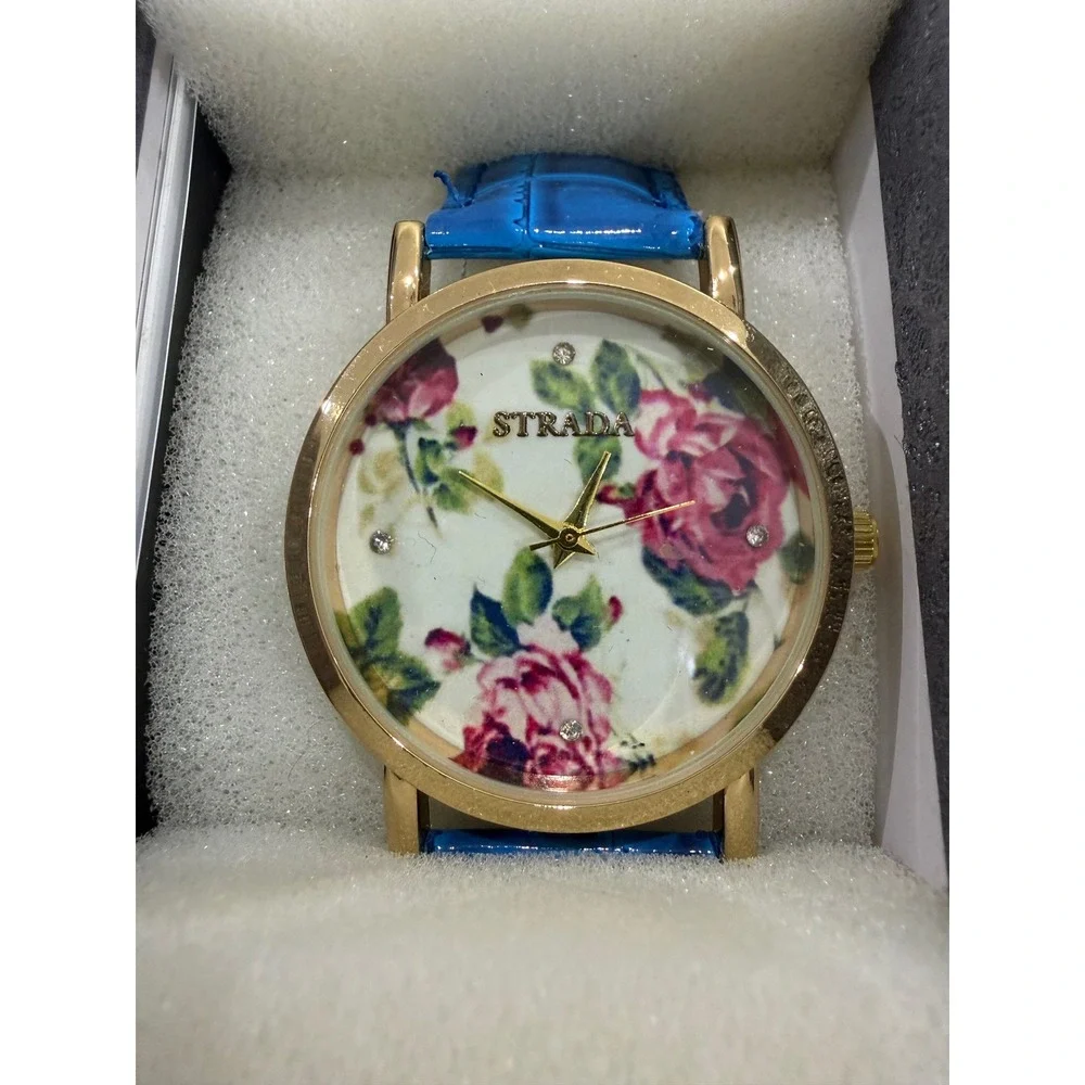 Strada Womens Floral Dial Gold Tone Watch Blue Croc Embossed Strap with Box